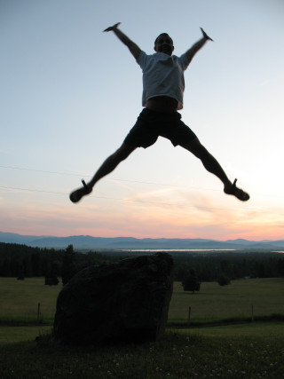 Man jumping sunset rock hands - dennis ashbaugh free wallpaper for mobile