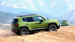 Mountain dirt road green jeep - a sky background and a mountain range in the distance free wallpaper