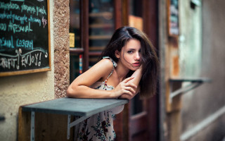 Woman leaning table chalkboard writing - a table in front free wallpaper