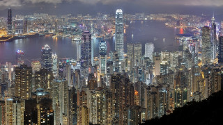City skyline night water architecture - a large city in the background free wallpaper