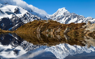 Mountain range lake coast clouds - a body of water in front free wallpaper