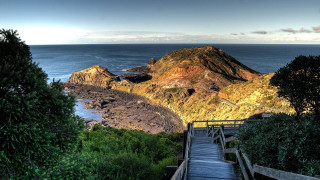 Wooden staircase rocky cliff ocean - a wooden staircase free wallpaper