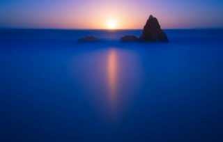 Rock ocean sunset bright sky 2 - a rock in the middle of the ocean free wallpaper