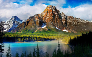 Mountain lake trees clouds landscape - a lake in the middle of it free wallpaper