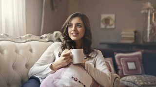 Woman sitting coffee mug pillow - a couch holding free wallpaper