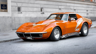 Orange sports car street building - a orange sports car free wallpaper