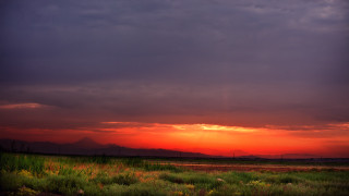 Sunset clouds grass mountains dusk - a sunset free wallpaper for desktop