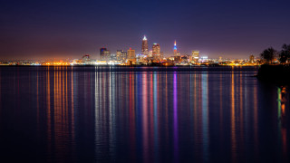 City skyline reflection night glowing - the building and the water free wallpaper
