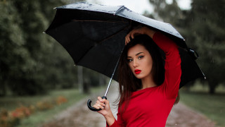 Woman red shirt umbrella rain - a path in a park free wallpaper