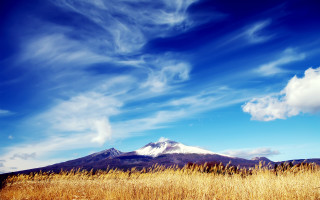 Field mountain clouds blue sky - white cloud free wallpaper for desktop