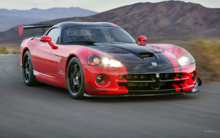 Red sports car mountains cloudy - a cloudy sky in the background free wallpaper