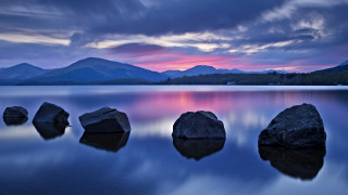 Rocky lake mountains cloudy sunset - a group of rocks free wallpaper