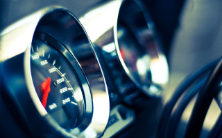 Speedometer red arrows tilt shift - a car dashboard free wallpaper