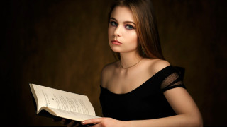 Woman black dress holding book 2 - a book in her hands free wallpaper