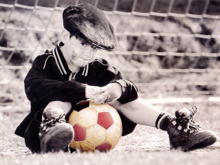 Young boy soccer ball glove - his knee free wallpaper