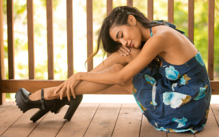 Woman sitting deck black hair - her knee free wallpaper