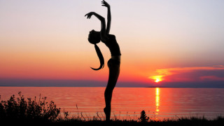 Yoga sunset water arabesque silhouette - dynamic pose free wallpaper