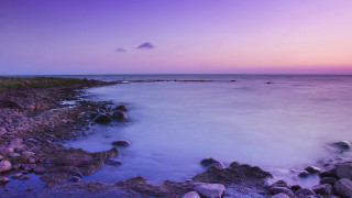 Rocky shore purple sky water - a purple sky and water free wallpaper