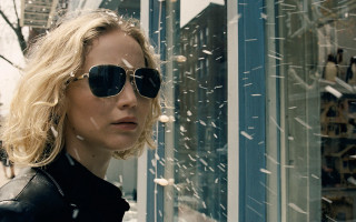 Woman sunglasses snow cityscape building - movie still free wallpaper