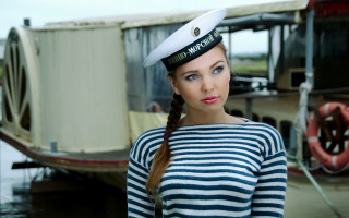Sailor woman boat kitsch portrait - a boat in the background free wallpaper