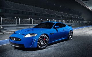 Blue sports car night stadium - a blue sports car free wallpaper
