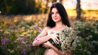 Woman flower field nature outdoors - the background and a building in the background free wallpaper
