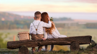 Couple sitting on log with - their lap free wallpaper for desktop