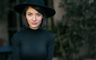 Woman black hat green tree - kai carpenter free wallpaper