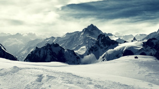 Skiing person snowy mountain mountains - a snowy mountain free wallpaper