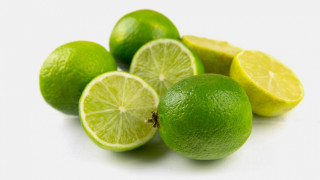 Pile limes halved wedge green - one cut free wallpaper