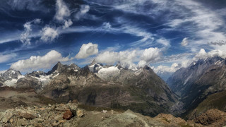 Mountain range clouds rocks panorama - a few rock below free wallpaper