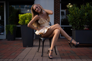 Woman dress smiling sitting crossed - fashion photoshoot free wallpaper