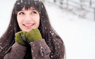 Woman smiling snow winter brownjacket - a brown jacket free wallpaper