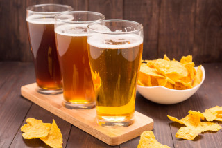 Three glasses beer chips wooden - a wooden table free wallpaper