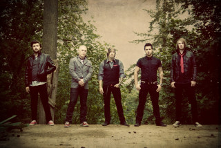 Men standing together trees bushes - eric taylor free wallpaper