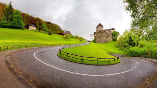Winding road stone building fence - romanesque free wallpaper