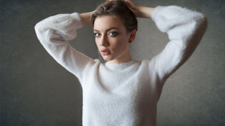 Woman white sweater holding hair - a white sweater free wallpaper