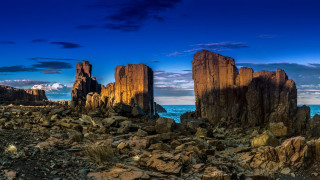 Rocky beach blue sky clouds - a rocky beach free wallpaper