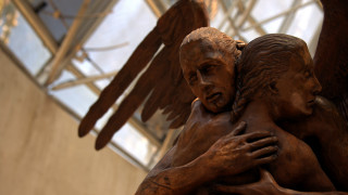 Bronze statue hugging woman wings - sculpture free wallpaper
