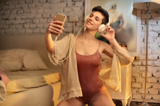 Woman brown bodysuit cellphone sitting - elizabeth polunin free wallpaper for desktop