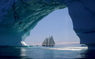 Sailboat iceberg ocean blue sky - bascove free wallpaper