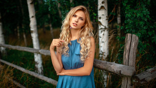 Woman blue dress fence portrait - a fence free wallpaper