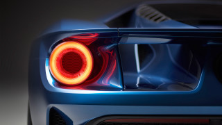 Blue sports car tail light - a red circle free wallpaper