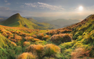 Grassy valley mountain sunset clouds 2 - field free wallpaper