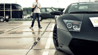 Man walking black sports car - past free wallpaper