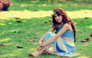 Woman sitting grass dress sandals 2 - her foot free wallpaper