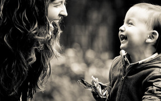 Woman child laughing black white - alison watt free wallpaper