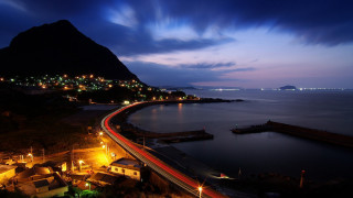 City mountain water night sky - a mountain in the background and a body of water free wallpaper