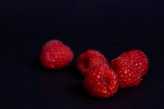 Three raspberries black background macro - berry free wallpaper for desktop
