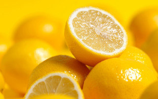 Lemons pile yellow surface cut - a yellow surface free wallpaper